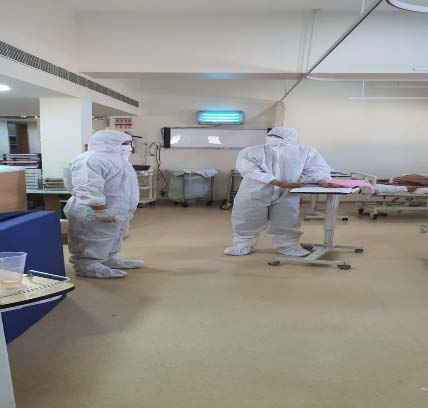 Figure 11: Disinfection Figure 13: Disinfection Spray Receiving a Suspect/positive patient from outside ? Prior information was given to the appropriate authority in the hospital. ? The COVID Code brown was activated. ? All dedicated personnel in COVID Care team were informed. ? The patient arrived in an ambulance and entered from EXIT Gate (to avoid risk to other patients) ? Accompanied by a security guard in full PPE to Isolation area ? Directly admitted in ISOLATION ward in separate Building (Annexe ) ? SOCIAL Responsibility: MCGM, Authorities were immediately in formed so that necessary precautions and actions could be taken, eg. contact tracing/line listing and quarantine or seal residential areas/buildings to prevent spread. ? Corridor sprayed with Sodium hypochlorite (from ambulance up to the ward entry)